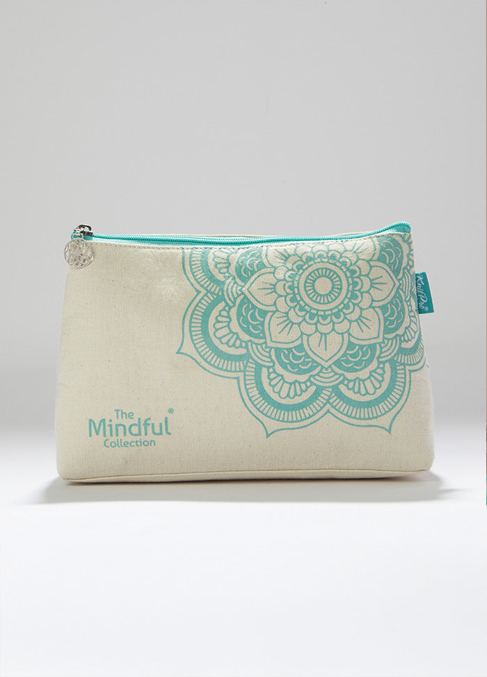 Mindful prcoject bag in turquoise cotton with floral design, featuring a mandala charm and zippered pocket for small items.