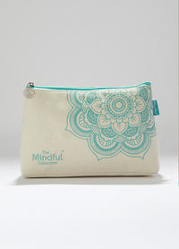 Mindful prcoject bag in turquoise cotton with floral design, featuring a mandala charm and zippered pocket for small items.
