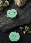 Two green tea row counters adorned with flowers, part of a teal knitting tool case featuring a mandala design and easy-to-read numbers