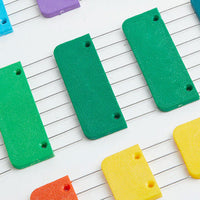  A vibrant set of plastic knit blockers featuring sharp stainless steel pins, designed for effective blocking of yarn projects.