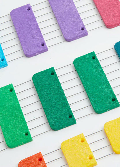  A vibrant set of plastic knit blockers featuring sharp stainless steel pins, designed for effective blocking of yarn projects.