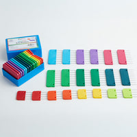 A box containing colorful plastic blocking blocks, designed with stainless steel pins for securing knit and crochet pieces.