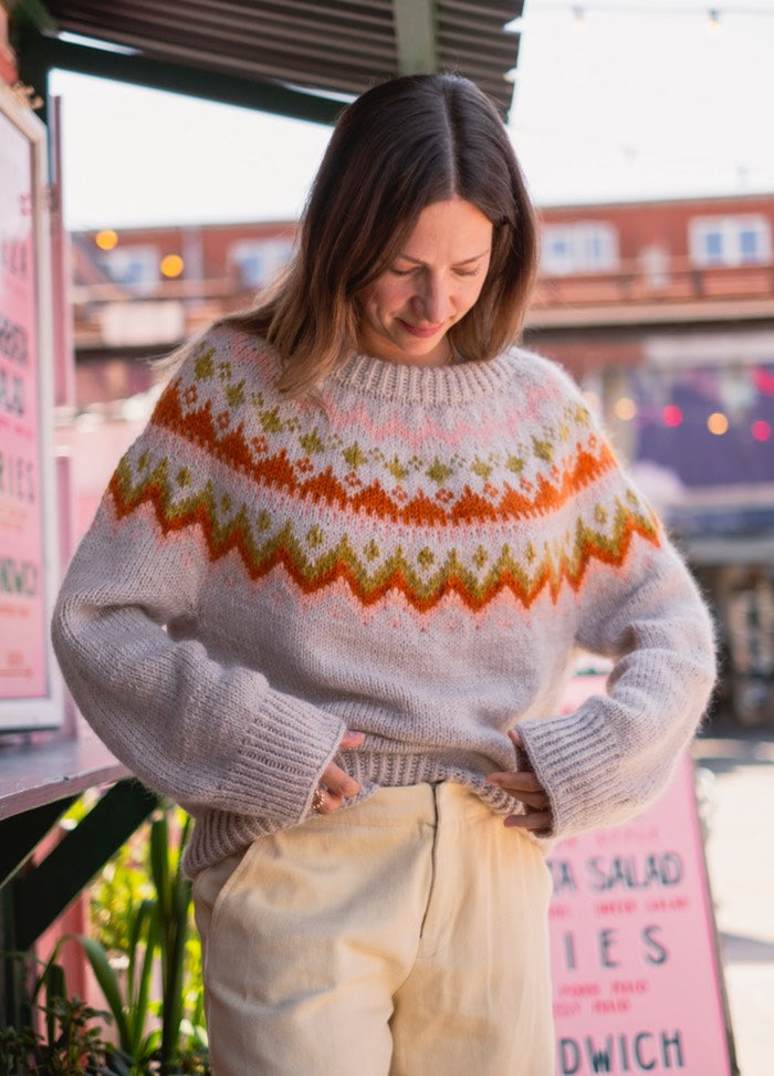 Playful Palette Sweater: Light knit with vibrant orange, green, and yellow motifs across the yoke.