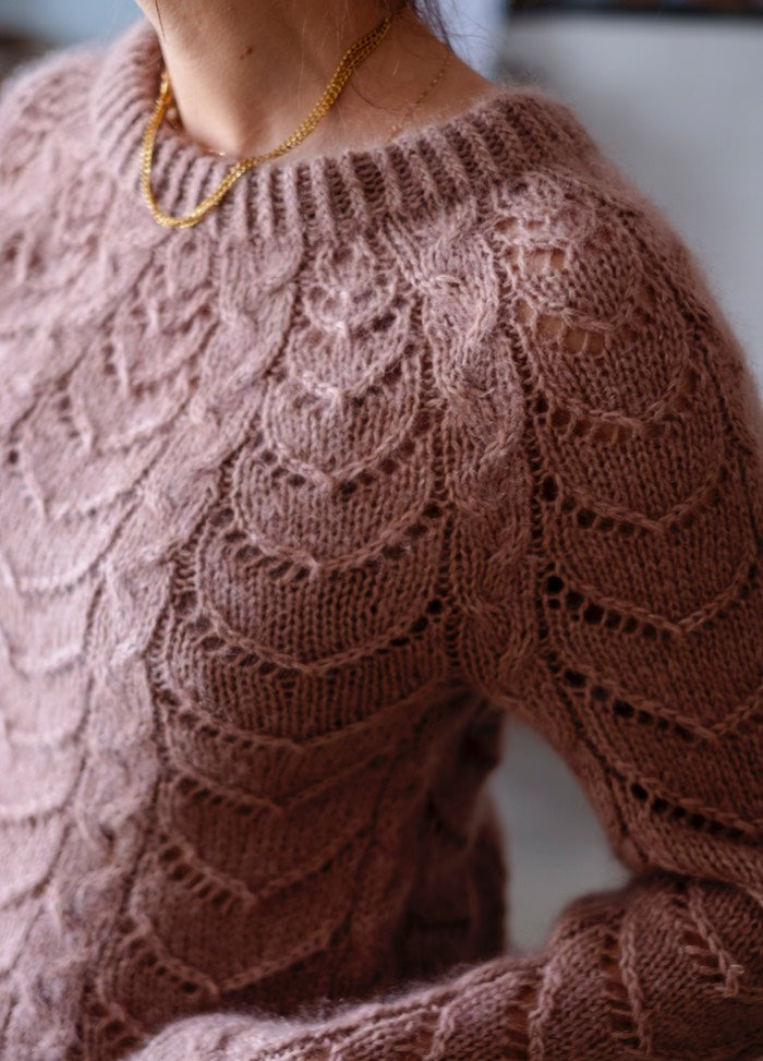Sweetheart Sweater: Light brown knit with leaf-like textured pattern and ribbed neckline, styled with a gold necklace.