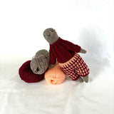 Fern the Wombat in the Brown and Red Colourway with yarn only