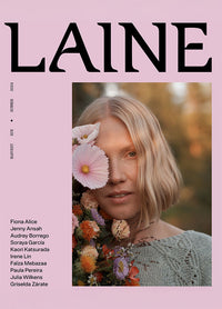 LAINE Issue 21: pink cover featuring a blurred figure holding flowers, with contributor names listed vertically.