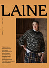 Front cover of Laine Winter 2025 featuring a blurred model in a patterned sweater and plaid skirt against an orange background.