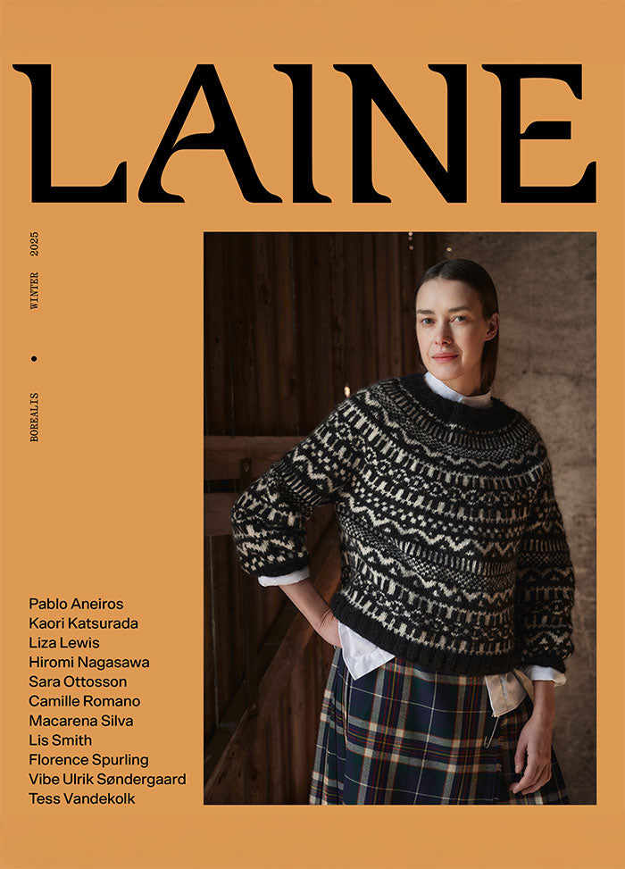 Front cover of Laine Winter 2025 featuring a blurred model in a patterned sweater and plaid skirt against an orange background.