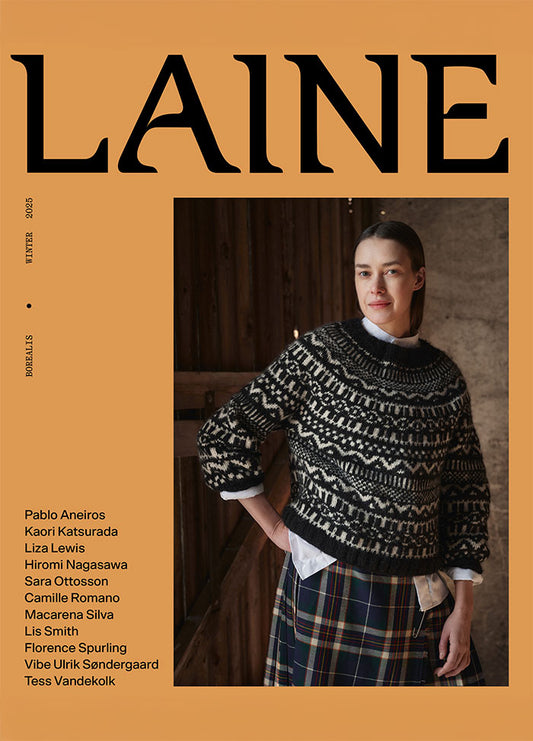 Front cover of Laine Winter 2025 featuring a blurred model in a patterned sweater and plaid skirt against an orange background.