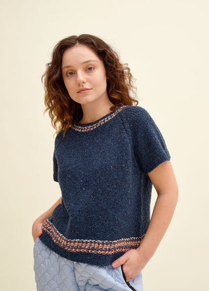 Koralli Sweater: dark blue short-sleeved knit with light decorative patterns at neckline and hem
