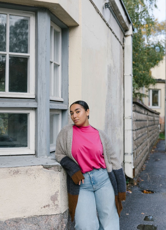 Marley Cardigan: color-blocked knit in gray, dark blue, and brown worn over a pink shirt and light blue jeans