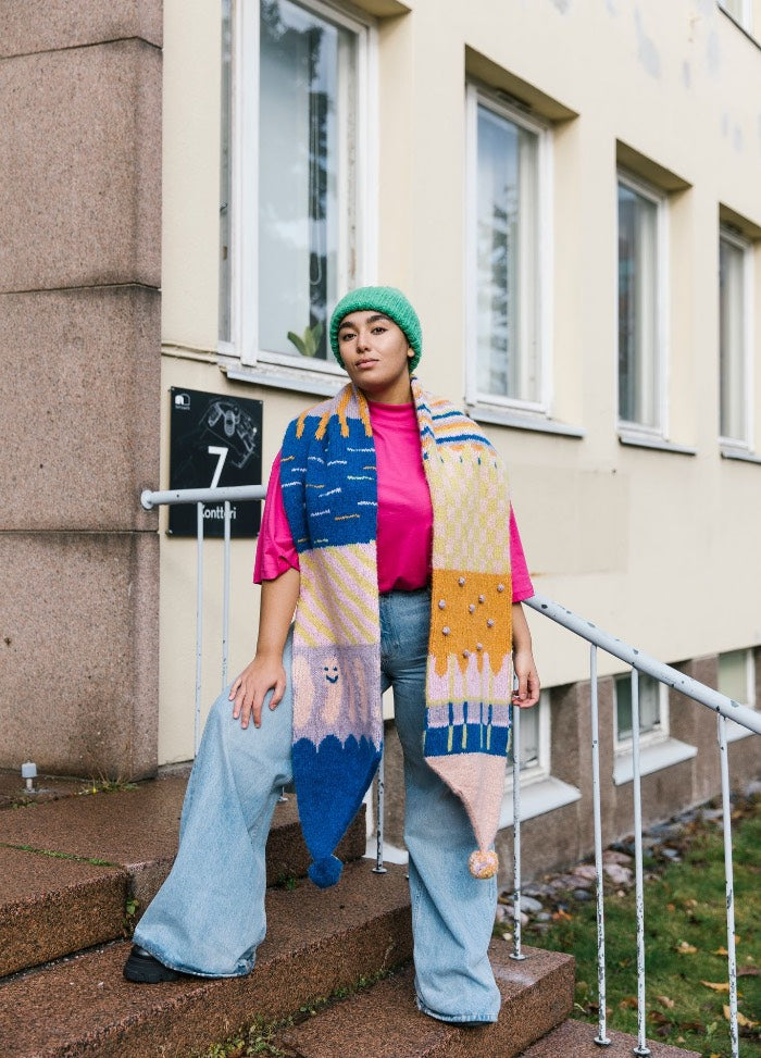 Iloisa Scarf: multicolored patterned scarf with faces and abstract shapes in blue, yellow, pink, and orange