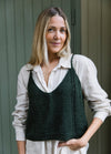 Aila Top: dark green knit with thin straps and V-neck, layered over white shirt.