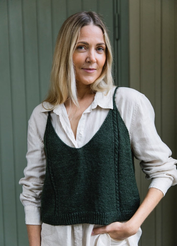 Aila Top: dark green knit with thin straps and V-neck, layered over white shirt.