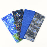 Four fabric swatches with blue and patterned designs on a white background