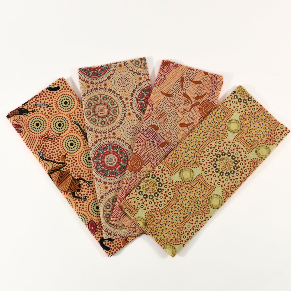 Set of four fabric swatches with Aboriginal art patterns on a white background