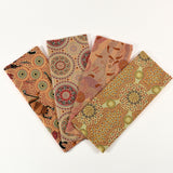 Set of four fabric swatches with Aboriginal art patterns on a white background