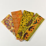 Four colorful fabric swatches with various patterns on a white background