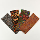 Four fabric swatches with Aboriginal art patterns on a white background