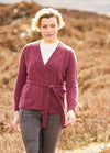 An elegant wrapover cardigan in Felted Tweed, worked in ladder stitch with a tie belt, long sleeves, and a deep ribbed V-neck for a clean, modern line.