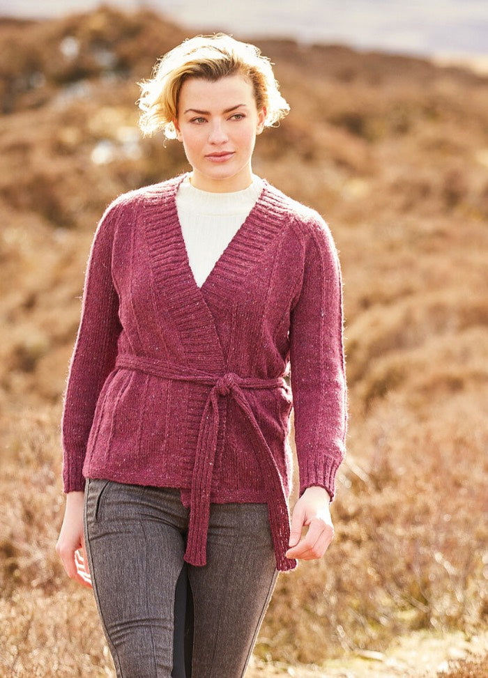 An elegant wrapover cardigan in Felted Tweed, worked in ladder stitch with a tie belt, long sleeves, and a deep ribbed V-neck for a clean, modern line.