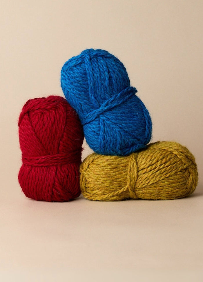 Three colourful balls of plush, bulky yarn made from 100% baby alpaca, perfect for cosy, sensitive-skin projects.
