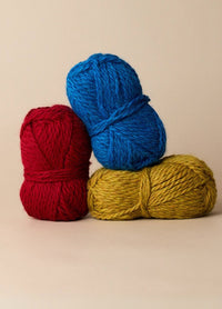 Three colourful balls of plush, bulky yarn made from 100% baby alpaca, perfect for cosy, sensitive-skin projects.