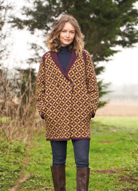 Statement Fair Isle coatigan with shawl collar, raglan shaping, double-breasted button front and pockets in cosy Alpaca Soft DK.