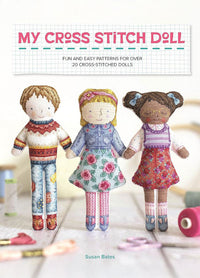 Cover of My Cross Stitch Doll, featuring a whimsical illustration of a cross-stitched doll with a floral dress and yarn hair, set against a soft pastel background. The title is displayed in playful, bold lettering at the top.