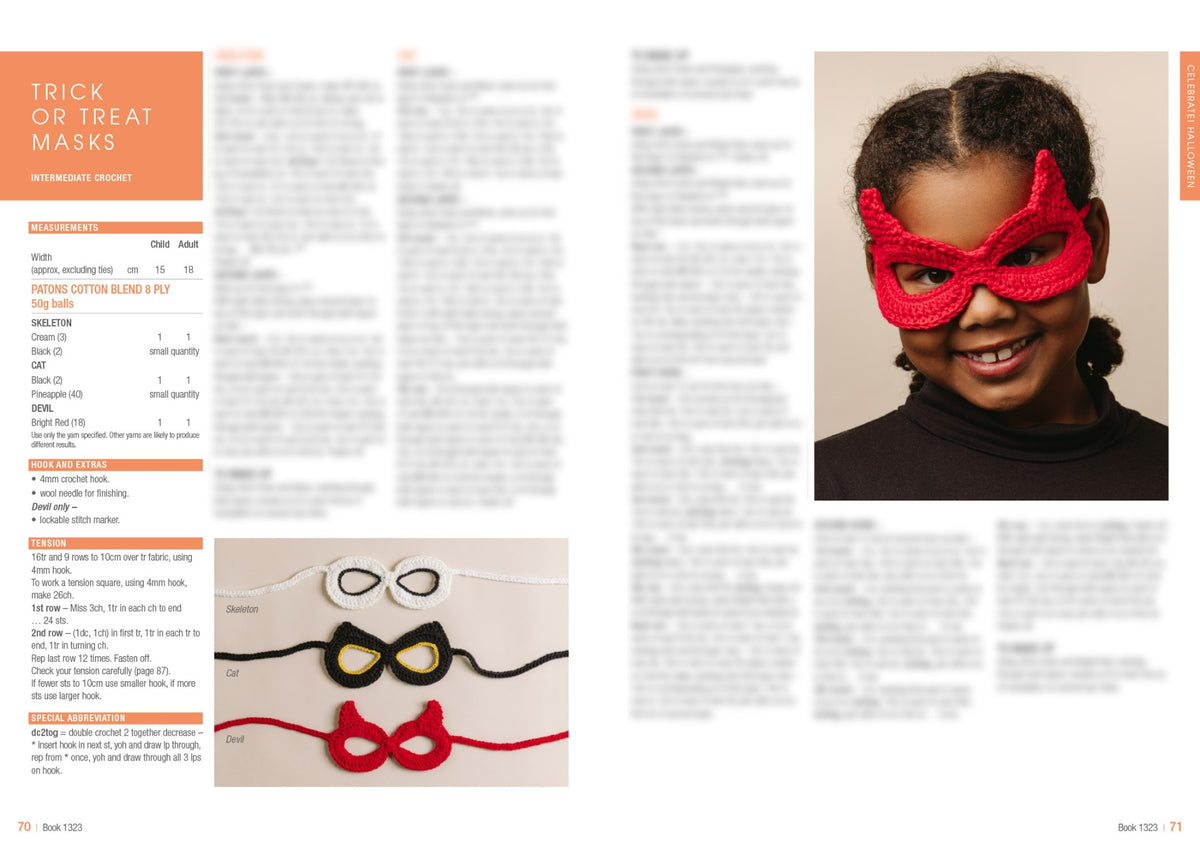 A child with curly hair smiles while wearing a vibrant red crocheted mask. Three masks in white, yellow, and red lie on a table below.