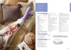 A cozy scene with a person knitting on a bed. They wear long purple socks and hold a pink hat. A textured cushion and knitting supplies are nearby, conveying warmth and relaxation. Text details a knitting pattern for socks.