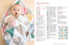 A baby lies on a colorful, geometric-patterned blanket with pastel triangles, next to text titled "Triangle Rug" with crafting instructions. The scene is warm and playful.