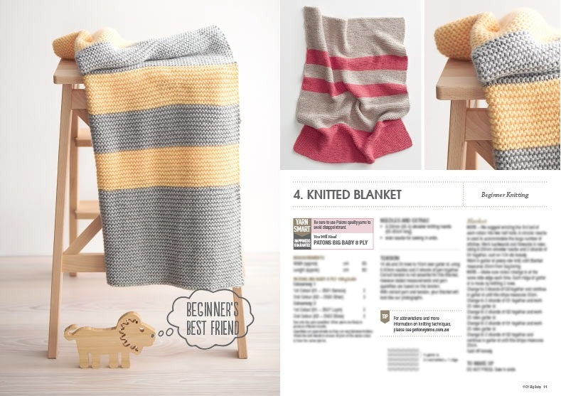 A knitted blanket with yellow and gray stripes is draped over a wooden ladder. Nearby, a wooden lion with a speech bubble reads "Beginner's Best Friend." A page on knitted blankets is on the right. Light, cozy atmosphere.
