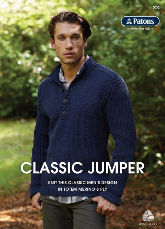 Man in a navy knit sweater stands in a sunlit forest, conveying a peaceful, classic style. Text includes "Patons" and "Classic Jumper" with a Woolmark logo.