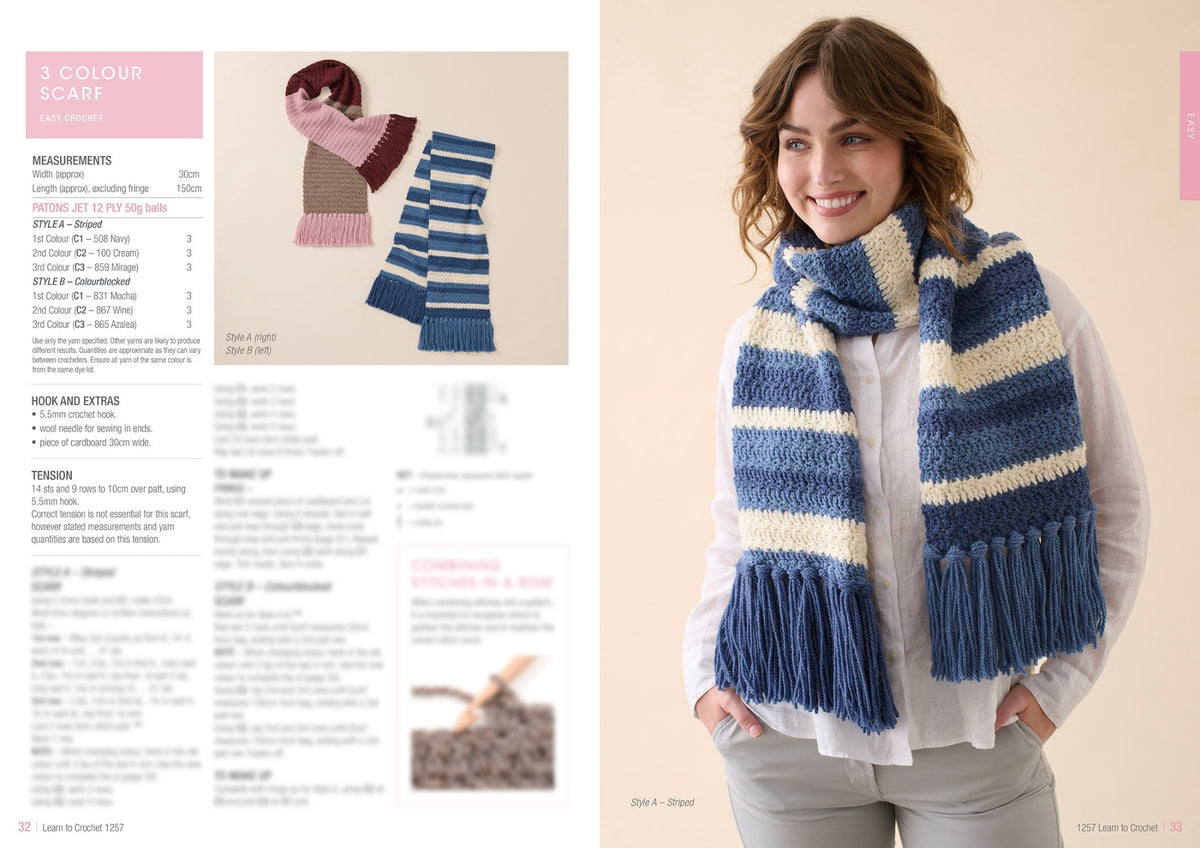 A woman smiles, modeling a blue and cream striped scarf with fringe. Nearby, two more scarves are displayed flat: one pink and brown, the other blue.