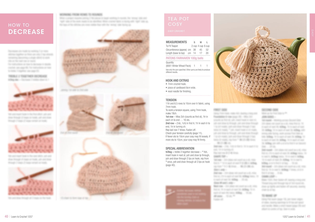 Two-page spread from a crochet magazine. Left page shows step-by-step images and instructions on decreasing stitches, featuring a crochet hook in beige yarn. Right page details a crochet pattern for a cozy tea pot cover in beige yarn with tassels, placed on a wooden surface. Text includes measurements, materials, and techniques.