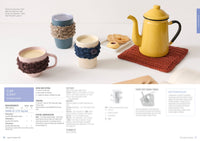 Cozy scene with a yellow teapot on a crocheted mat, three cups with knitted cozies, and a plate of cookies. Craft instructions are partially visible. Warm, inviting tone.
