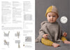 A baby wearing a cozy gray knitted poncho and a yellow and beige hat sits against a gray background. The baby looks curiously at the camera. On the left, there are blurred knitting patterns and instructions, with a focus on fringe and slip-stitch diagrams. The overall tone is warm and inviting.