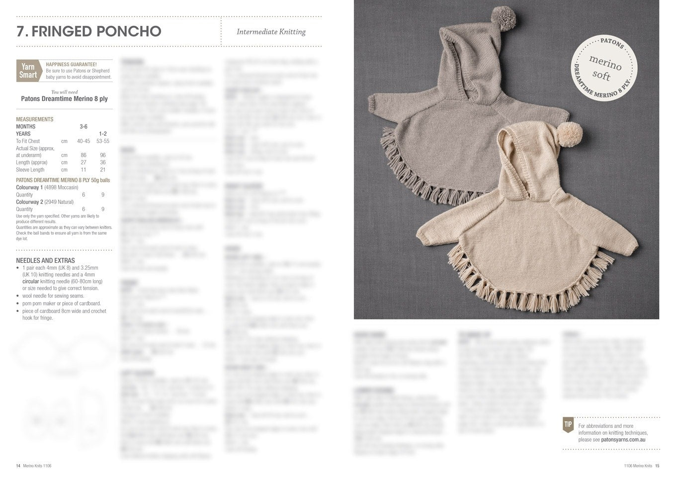 Two knitted ponchos with hoods and fringes lay side by side on a gray surface. One is gray, and the other beige. The setting conveys warmth and coziness.