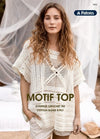 Woman in an oversized crochet top stands outdoors. The top is cream-colored with intricate patterns. She has wavy hair, and her expression is calm. Text reads "Motif Top."