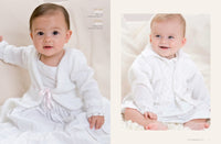 Two babies wearing cozy white knit cardigans. The left baby sits on a white surface with a pink bow, while the right baby smiles sitting on a soft blanket.