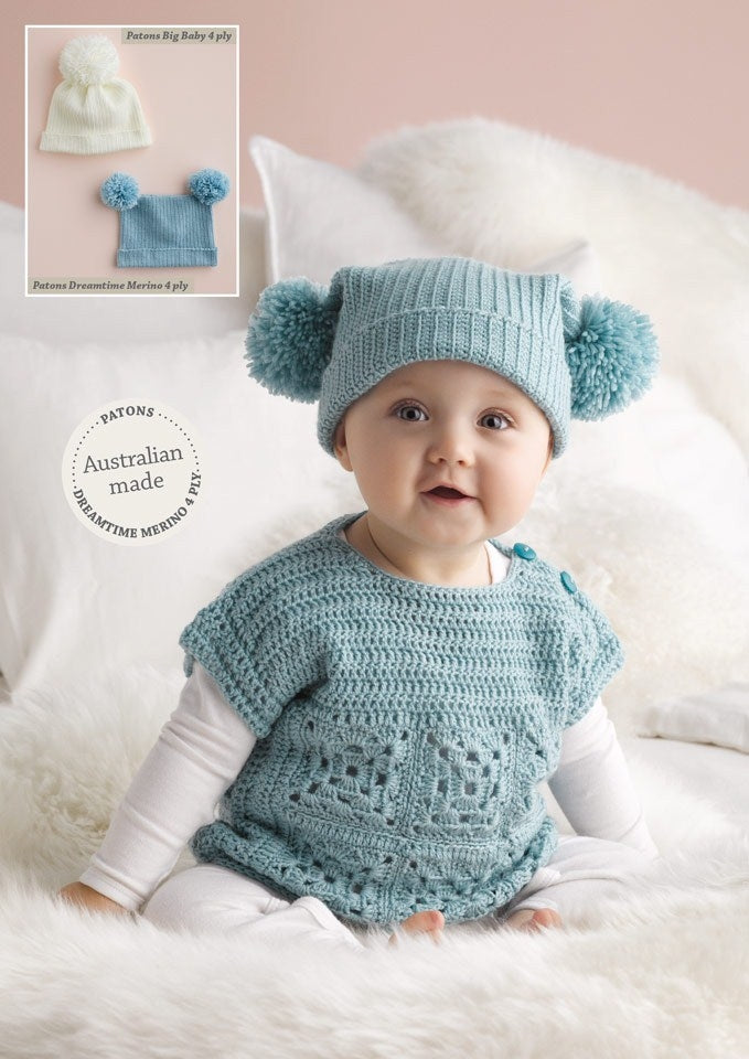 A baby wearing a blue crocheted top and pom-pom hat sits on a fluffy white blanket. Inset shows two hats: cream and blue. Tone: cozy, cheerful.