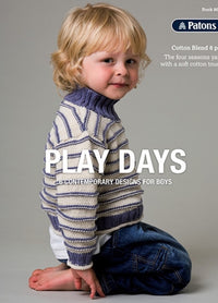 Young child with blonde hair, smiling softly, kneels in a striped sweater and jeans on a gray background. Text reads "Play Days: Contemporary Designs for Boys."