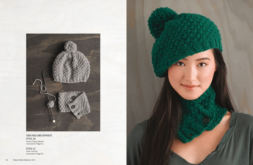 A woman wears a textured green beret with a pom-pom and matching neck warmer, smiling gently. Nearby, a grey hat and wrist warmers are displayed flat. Cozy, stylish winter attire.