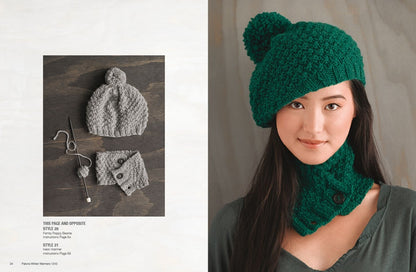 A woman wears a textured green beret with a pom-pom and matching neck warmer, smiling gently. Nearby, a grey hat and wrist warmers are displayed flat. Cozy, stylish winter attire.