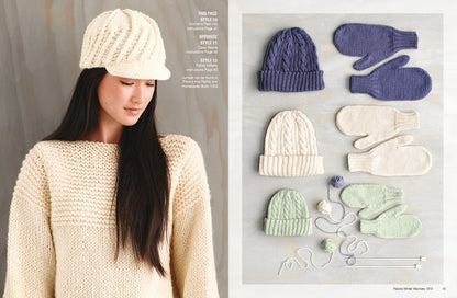 A woman in a cream knit sweater and hat looks down, serene. Beside her, neatly arranged knit hats and mittens in cream, lavender, and mint. Cozy winter theme.