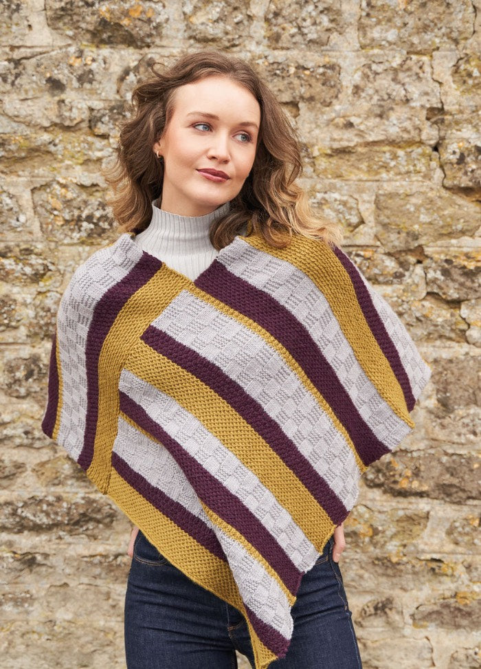 Season-spanning poncho worked as two rectangular panels in bold, textured stripes using three shades of Alpaca Soft DK.