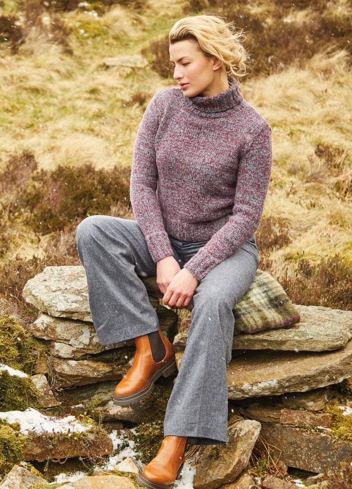 A classic polo-neck sweater knit with two strands of Felted Tweed held together for a chunkier look and feel, finished with long sleeves and ribbed cuffs and hem.
