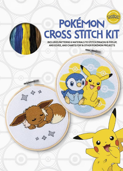 A vibrant cross-stitch kit featuring Pikachu, Piplup, and Eevee. The kit includes a 48-page instruction booklet, two pieces of Aida fabric, embroidery floss in the correct colours, and a wooden embroidery hoop.