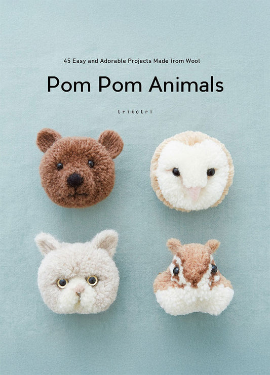 Cover of Pom Pom Animals: 45 Easy and Adorable Projects Made from Wool, showing five fuzzy animal faces made from pom-poms—including a bear, an owl, a rabbit, a fox, and a cat—arranged against a soft pale-blue background with the title centered above in simple black text.